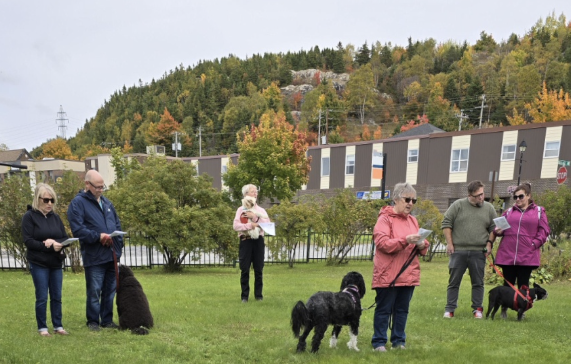 Group of people and pets at animal blessing in Corner Brook Newfoudland.